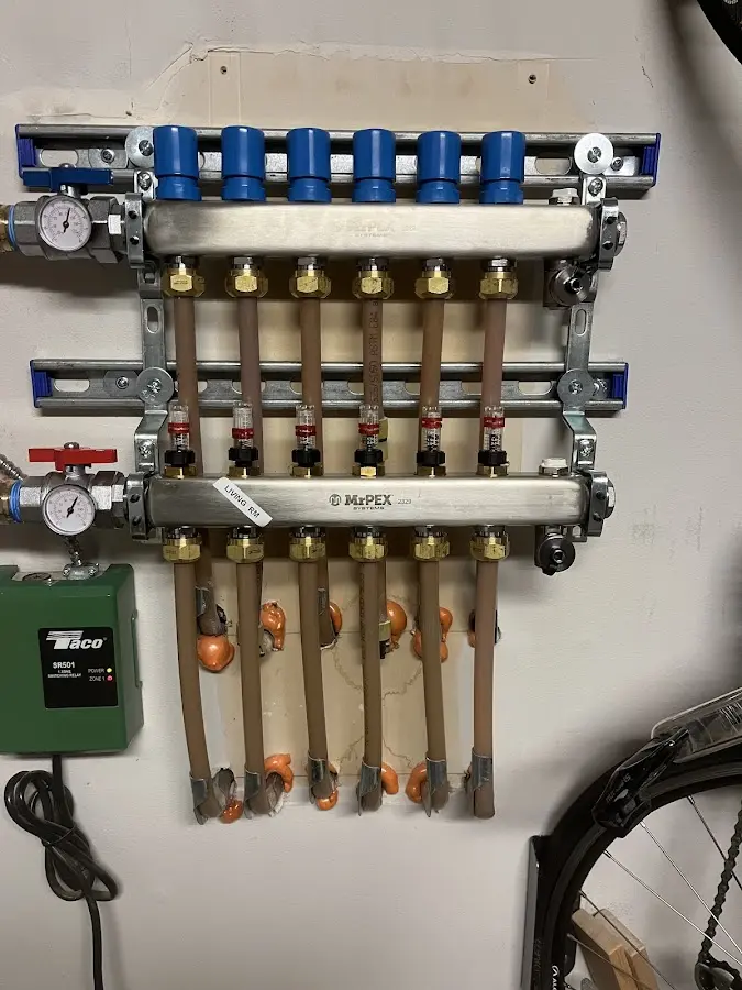 Plumber performing Water Heater Repair at a residential property in Mayville